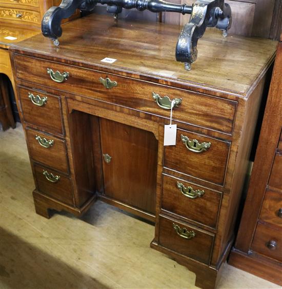 A George III mahogany kneehole desk, W.2ft 10in. D.1ft 8in. H.2ft 7in.